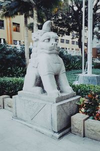 Statue against building