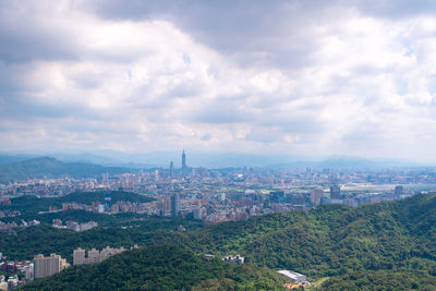 High angle view of city buildings against sky