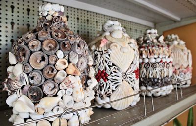 Antique containers in shelf for sale at store