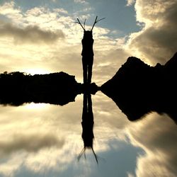 Low angle view of statue against cloudy sky