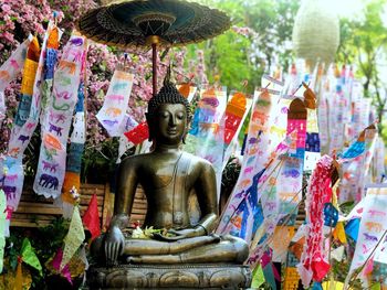 Buddha statue against temple