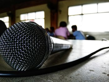 Close-up of people on table