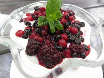 High angle view of strawberries in plate on table