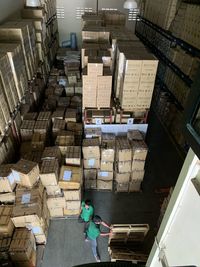 High angle view of people working in warehouse 