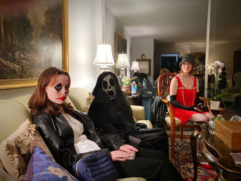 Side view of woman with dog at home