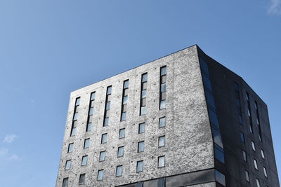 Low angle view of building against clear blue sky