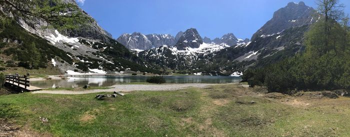 Scenic view of lake and mountains against sky