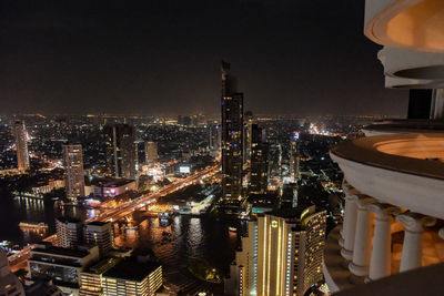 High angle view of illuminated buildings in city at night