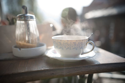 Close-up of coffee cup on table