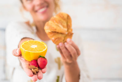 Close-up of woman holding ice cream