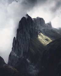 Scenic view of cliff against sky