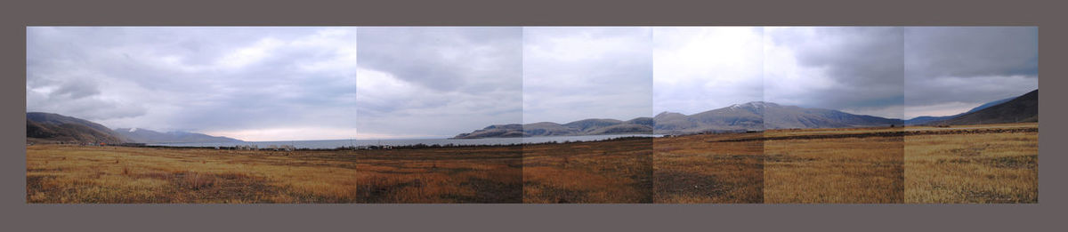 Scenic view of mountains against cloudy sky