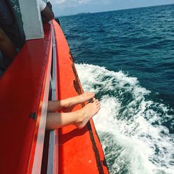 Man sailing on sea against sky