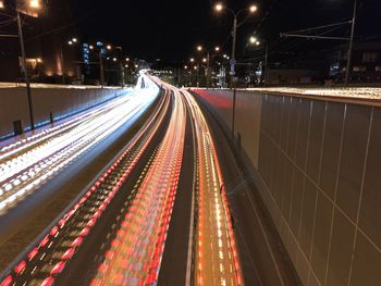 High angle view of light trails on road at night