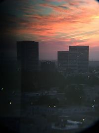 Cityscape against sky during sunset