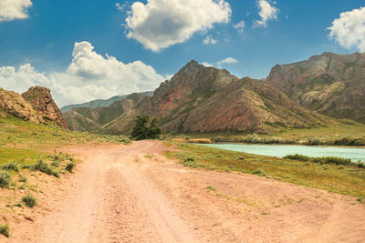 Scenic view of landscape and mountains against sky