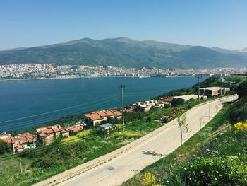 High angle view of harbor by sea against clear sky