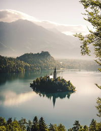 Scenic view of lake and mountains against sky