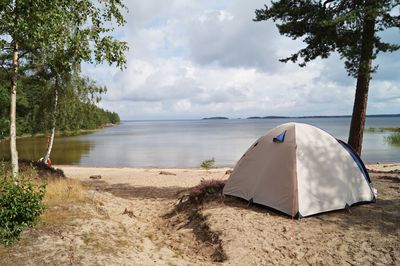 Scenic view of beach against sky while camping in nature 