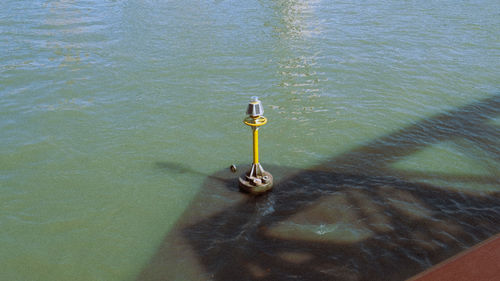 High angle view of metal in lake