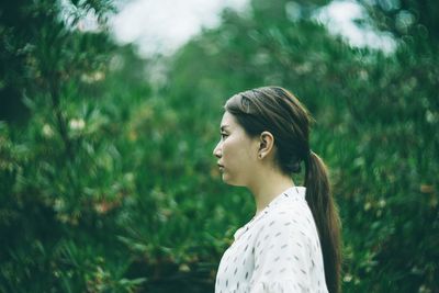 Portrait of young woman looking away