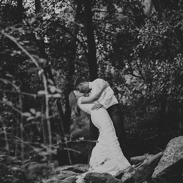 forest, tree, lifestyles, leisure activity, nature, tree trunk, standing, rear view, tranquility, casual clothing, sitting, growth, plant, day, water, rock - object, outdoors, full length