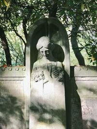 Close-up of statue in cemetery