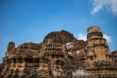 Low angle view of historical building against blue sky