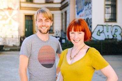 Portrait of happy young couple outdoors