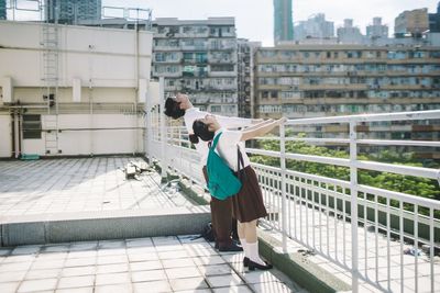 Woman standing in front of building