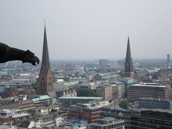 View of cityscape against clear sky