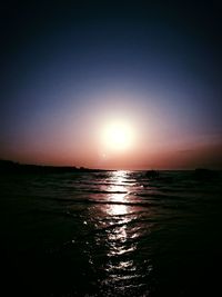 Scenic view of sea against clear sky during sunset