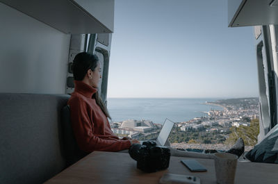 Man sitting on table at home