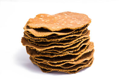 Close-up of bread against white background