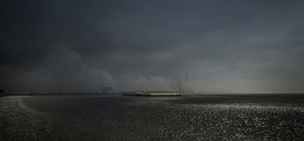 Scenic view power station by the beach