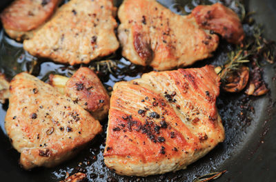 High angle view of meat on barbecue grill