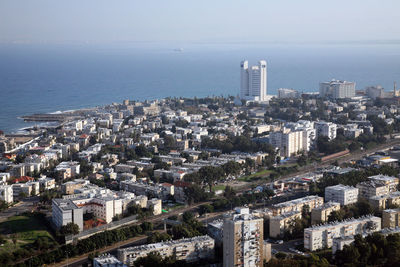 High angle view of city by sea