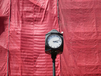 Low angle view of clock on wall