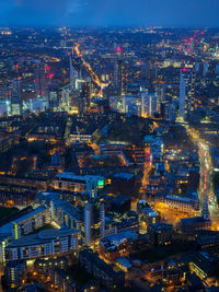 High angle view of illuminated buildings in city at night