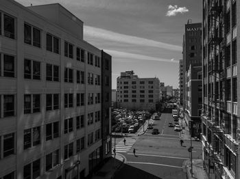 High angle view of street amidst buildings against sky