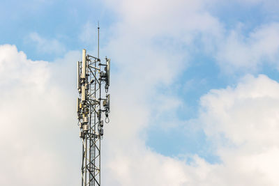 Low angle view of communications tower against sky