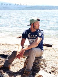 Young man sitting on beach