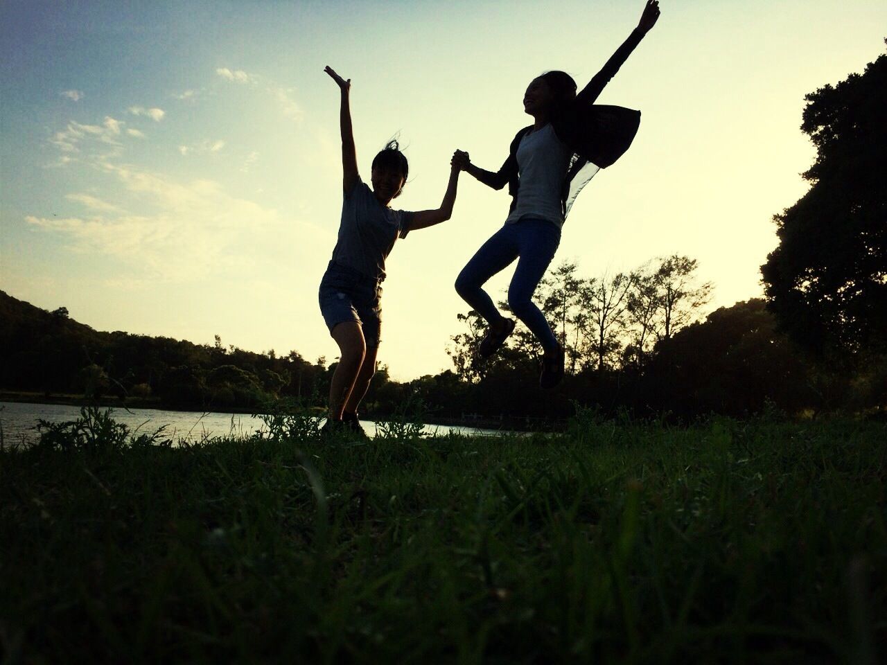 leisure activity, lifestyles, grass, full length, childhood, sky, field, standing, boys, casual clothing, enjoyment, men, tree, carefree, girls, arms raised, nature, playing