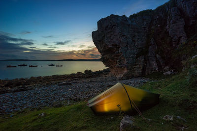 Tent at beach against sky