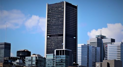 Low angle view of modern buildings against sky