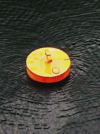 High angle view of water on wooden table