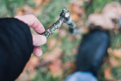 Close-up of cropped hand holding object