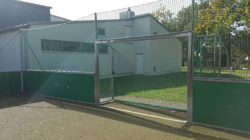 View of building seen through fence