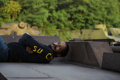 Low section of woman lying on field