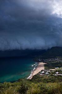 Scenic view of sea against storm clouds